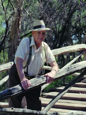 Lew Whiteman at log bridge