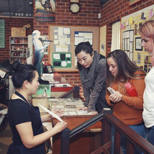 Bright Press - print shop - customers looking at work