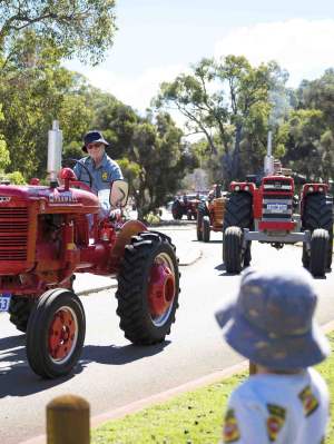 The Tractor Parade near the Village Junction Station with onlookers