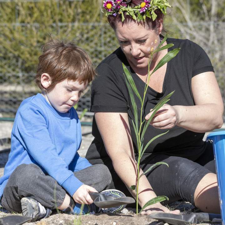 Children's Forest - mum and son planting