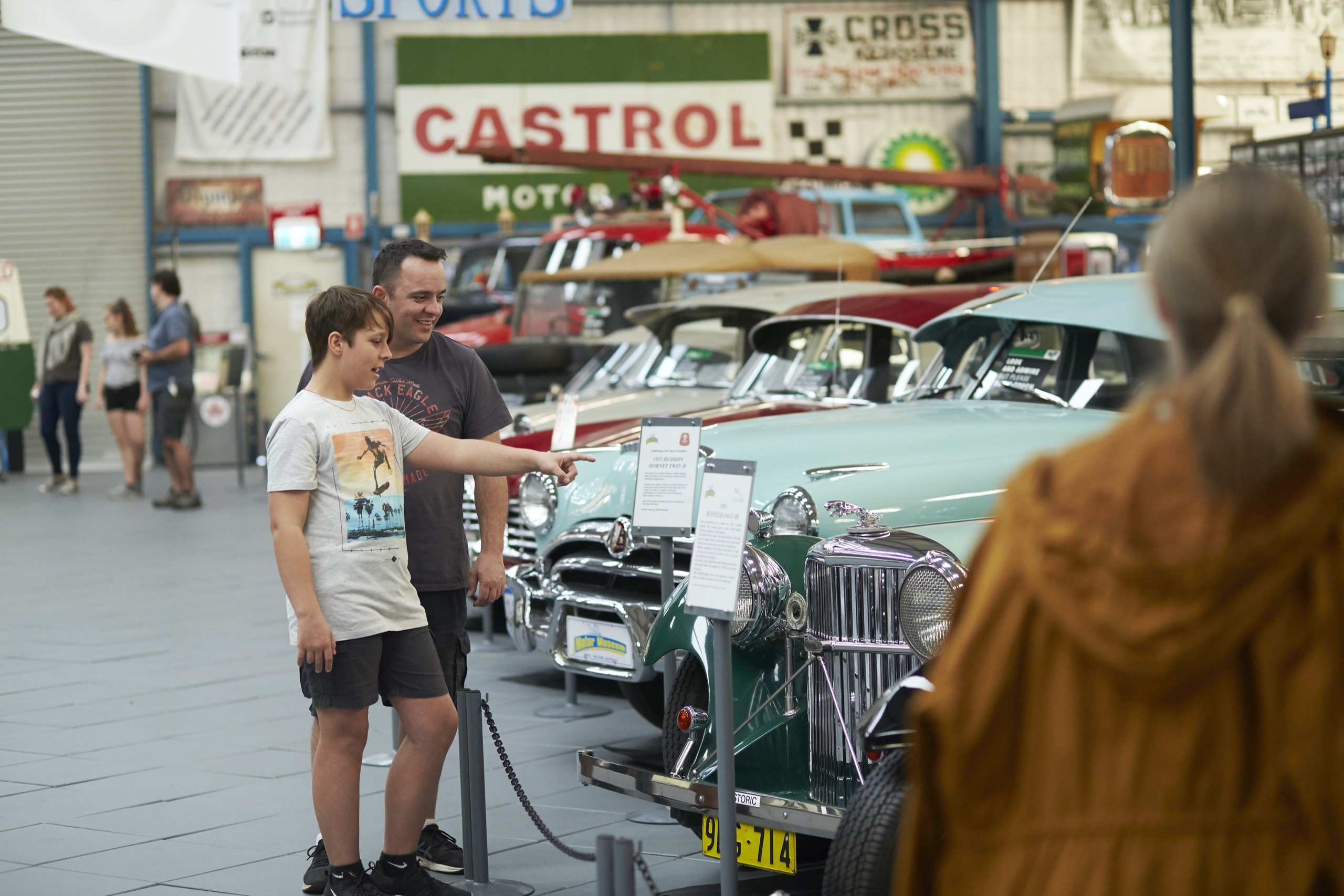 Motor Museum - inside - dad and son pointing